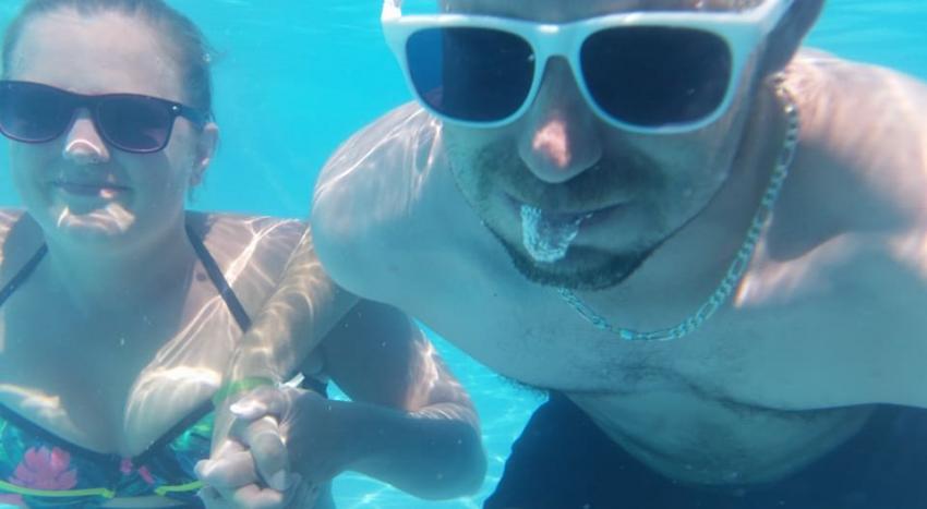 PoJoe taking a picture in a pool underwater