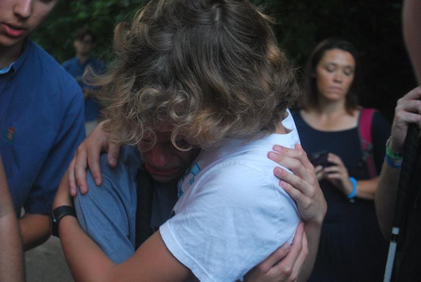 I am crying while hugging Gavin during Cross Carry