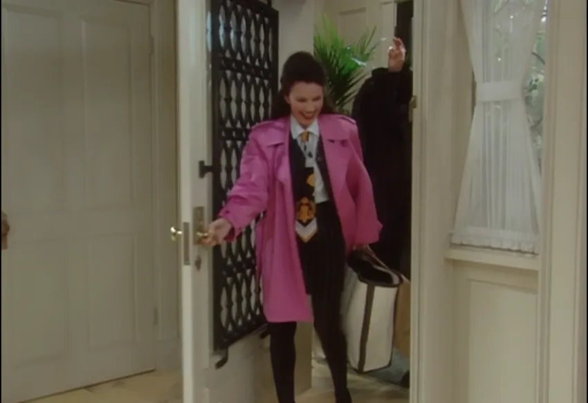Fran Fine wearing pinstripe set with bright pink coat