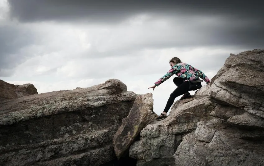 Woman rock climbing Take Risks without worrying about failure
