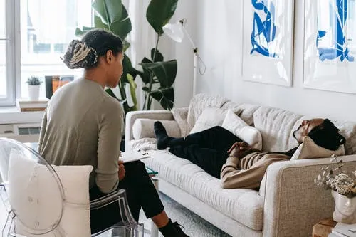 man engaging with therapist man and psychotherapist