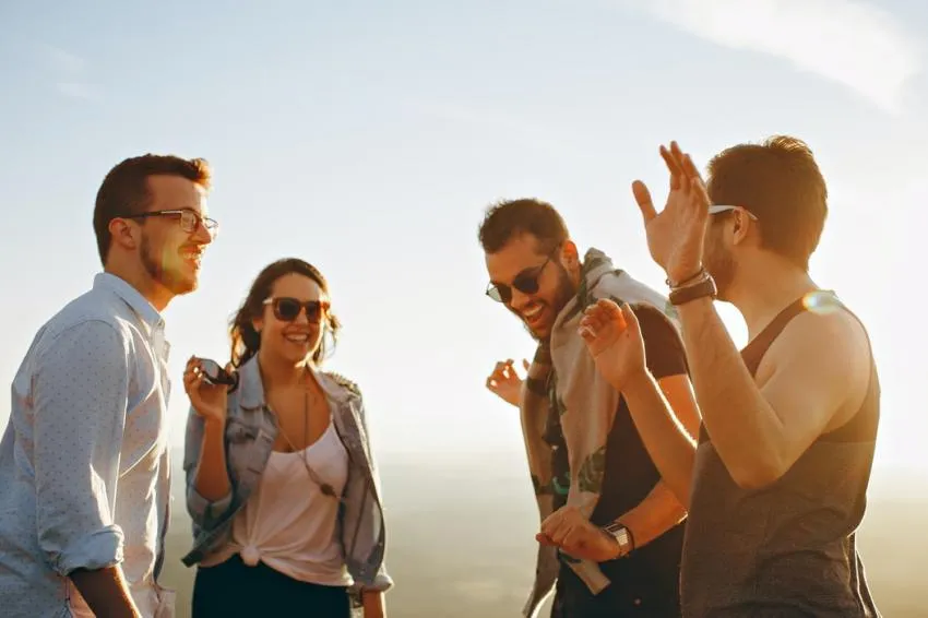 A Group of Friends Talking in the Sun