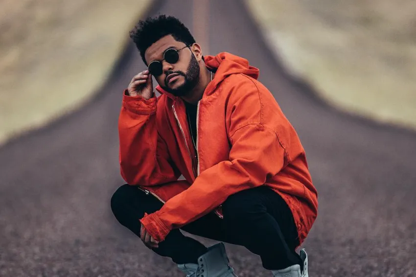 The Weeknd in Orange The Weeknd poses for a photo