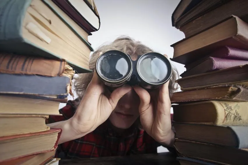 Person with binoculars observing