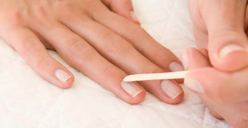 pushing back cuticles for manicure