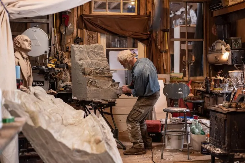 Sculptor working on a slab