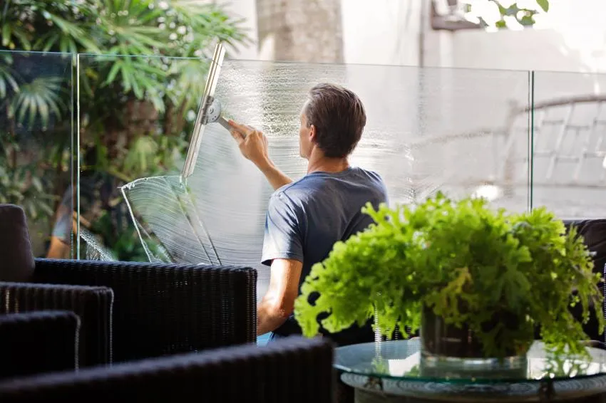 Man cleaning his home Declutter Your Space