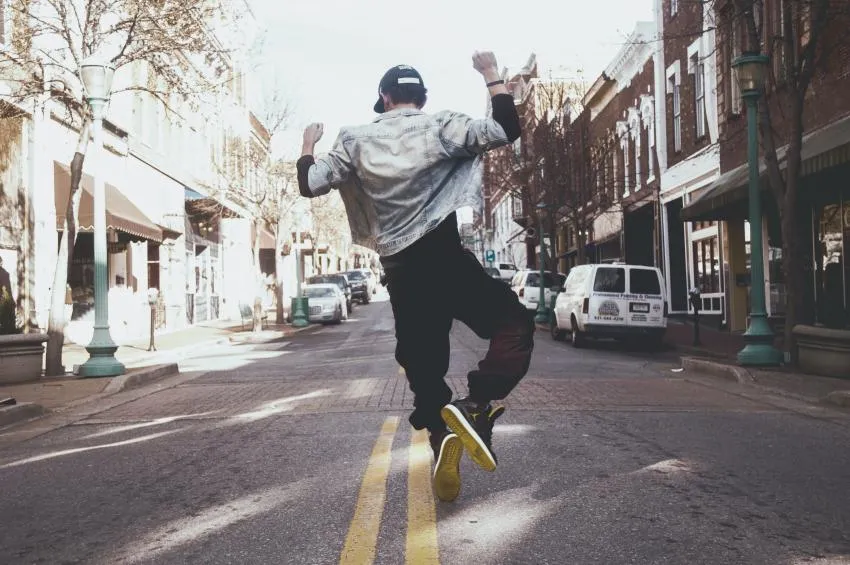 man jumping in street man jumping in street