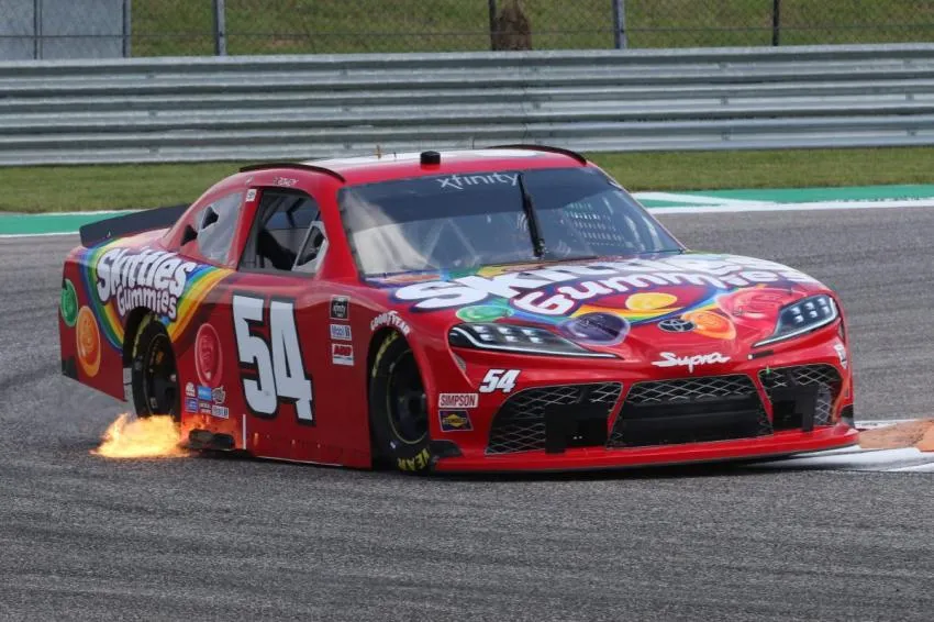 Exhaust flames from Kyle Busch's #54 Toyota Supra