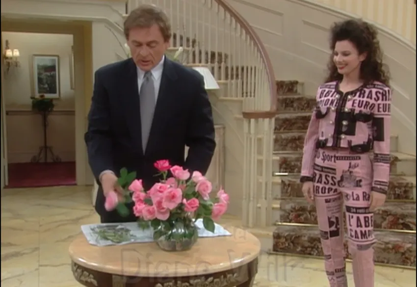 Fran Fine wearing pink newspaper print suit