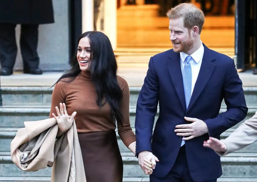 Harry and Meghan hold hands on walk