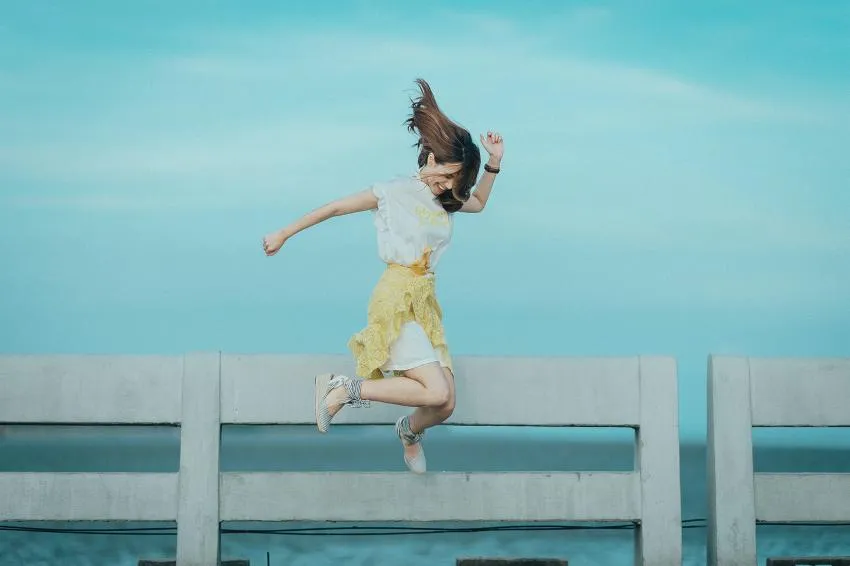 Happy woman jumping.