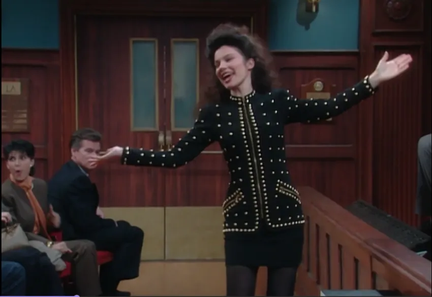 Fran Fine wearing bejeweled black jacket & matching skirt