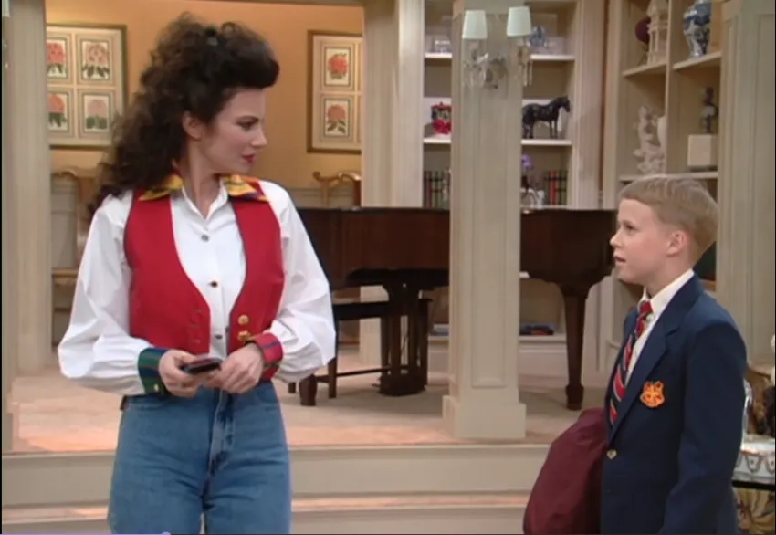 Fran Fine from The Nanny wearing white button down with colorful vest.