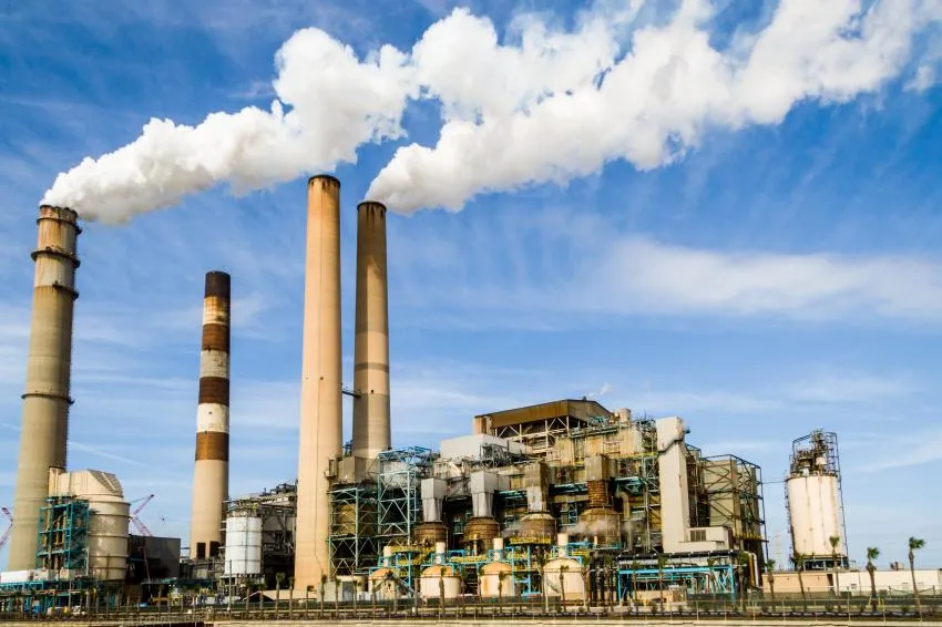 Industrial factory distributing to climate change and how the fashion industry is involved in this.