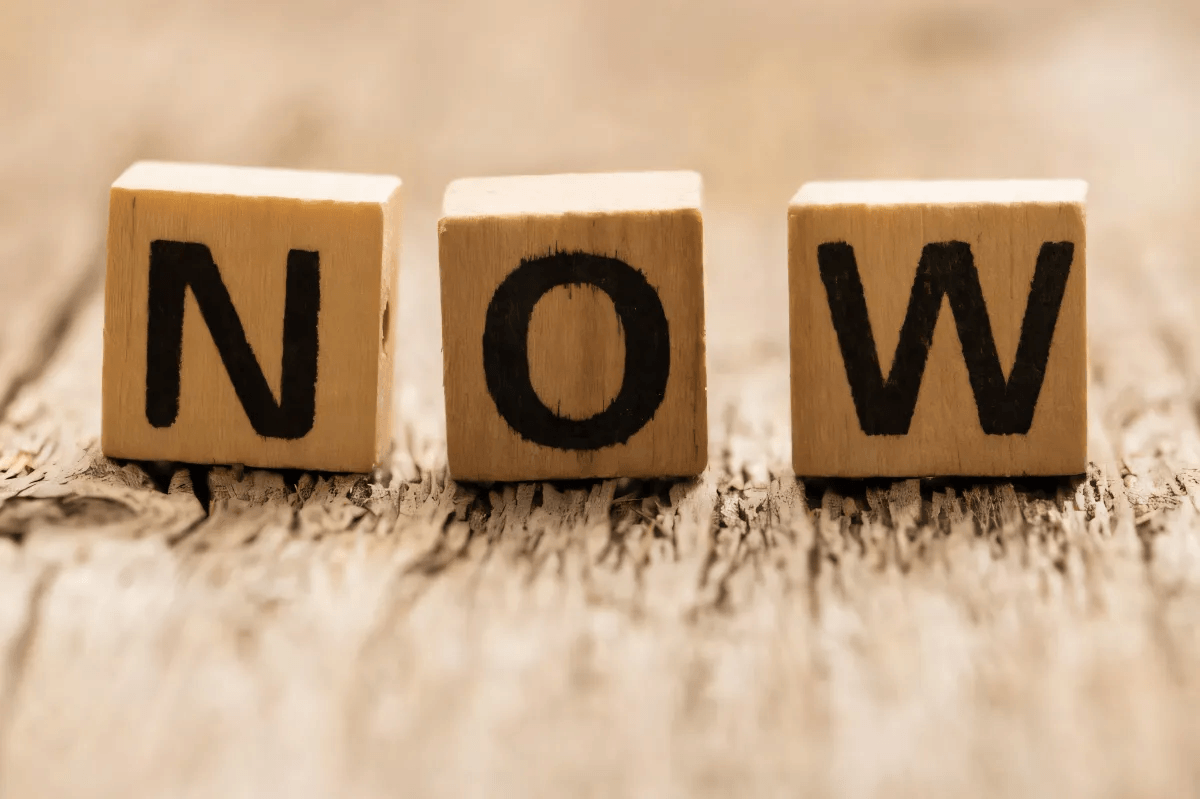 Wooden blocks spelling the word now