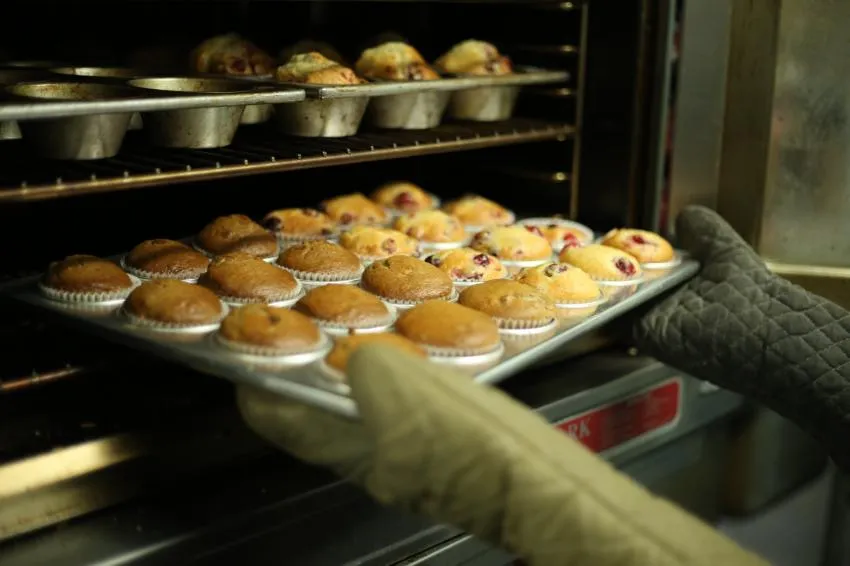 muffins going into oven muffins going into oven