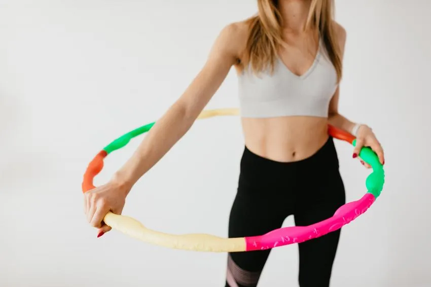 woman hula hooping woman hula hooping