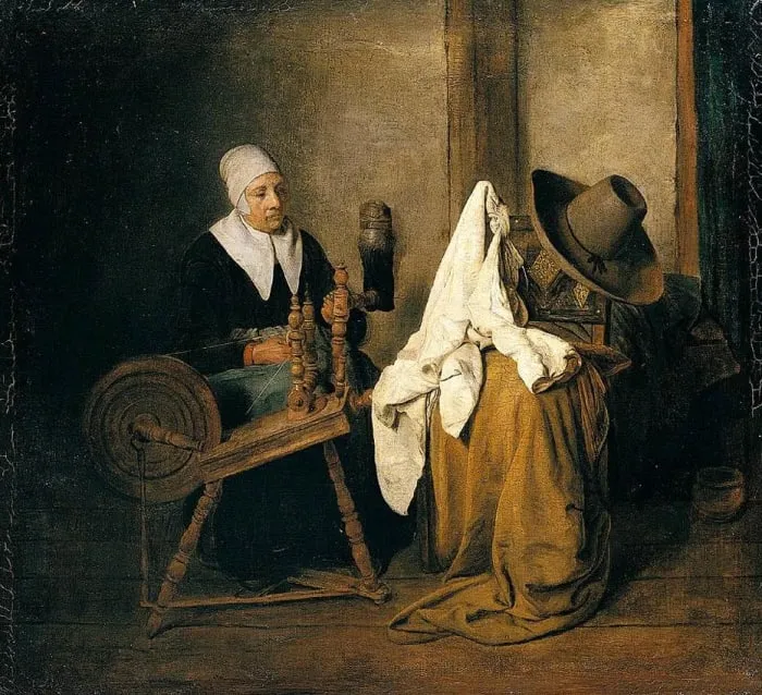 woman on a spinning wheel woman with spinning wheel making fabric