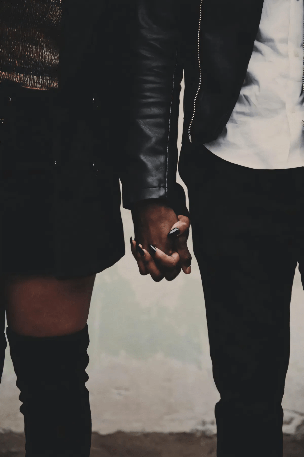 Image of a couple holding hands