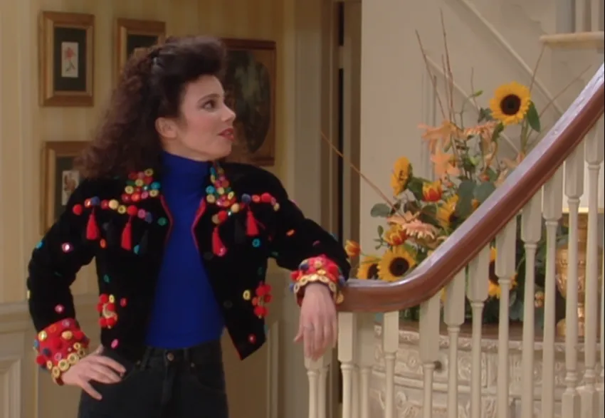 Fran Fine wearing black sweater with black turtleneck
