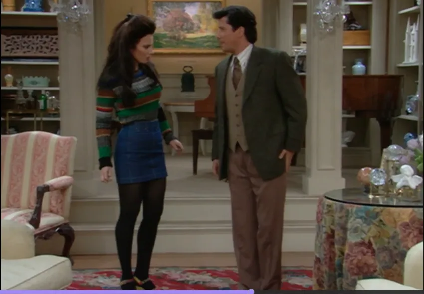 Fran Fine wearing sweater with mini jean skirt and platform heels